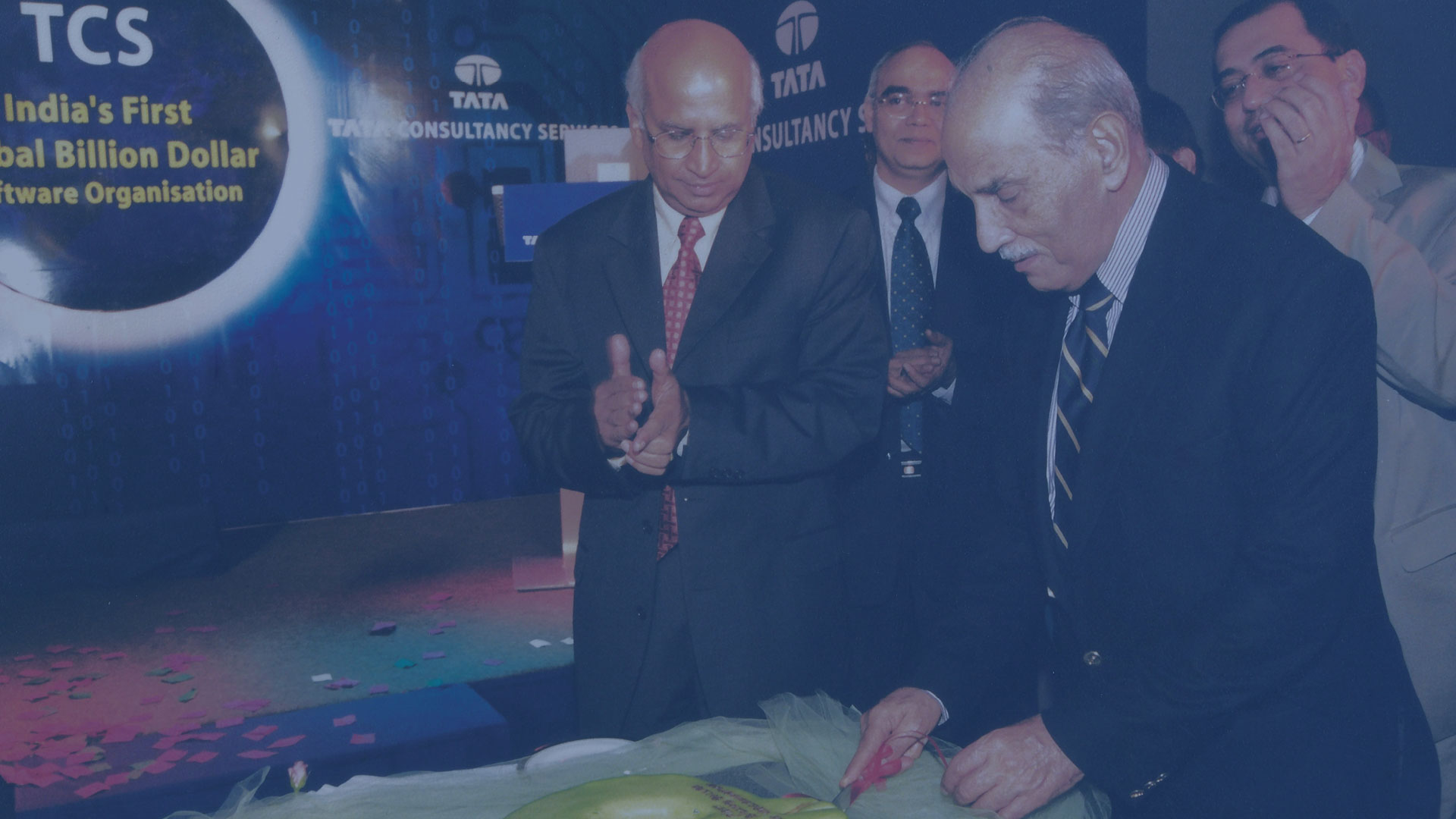 F C Kohli and S Ramadorai cut a cake