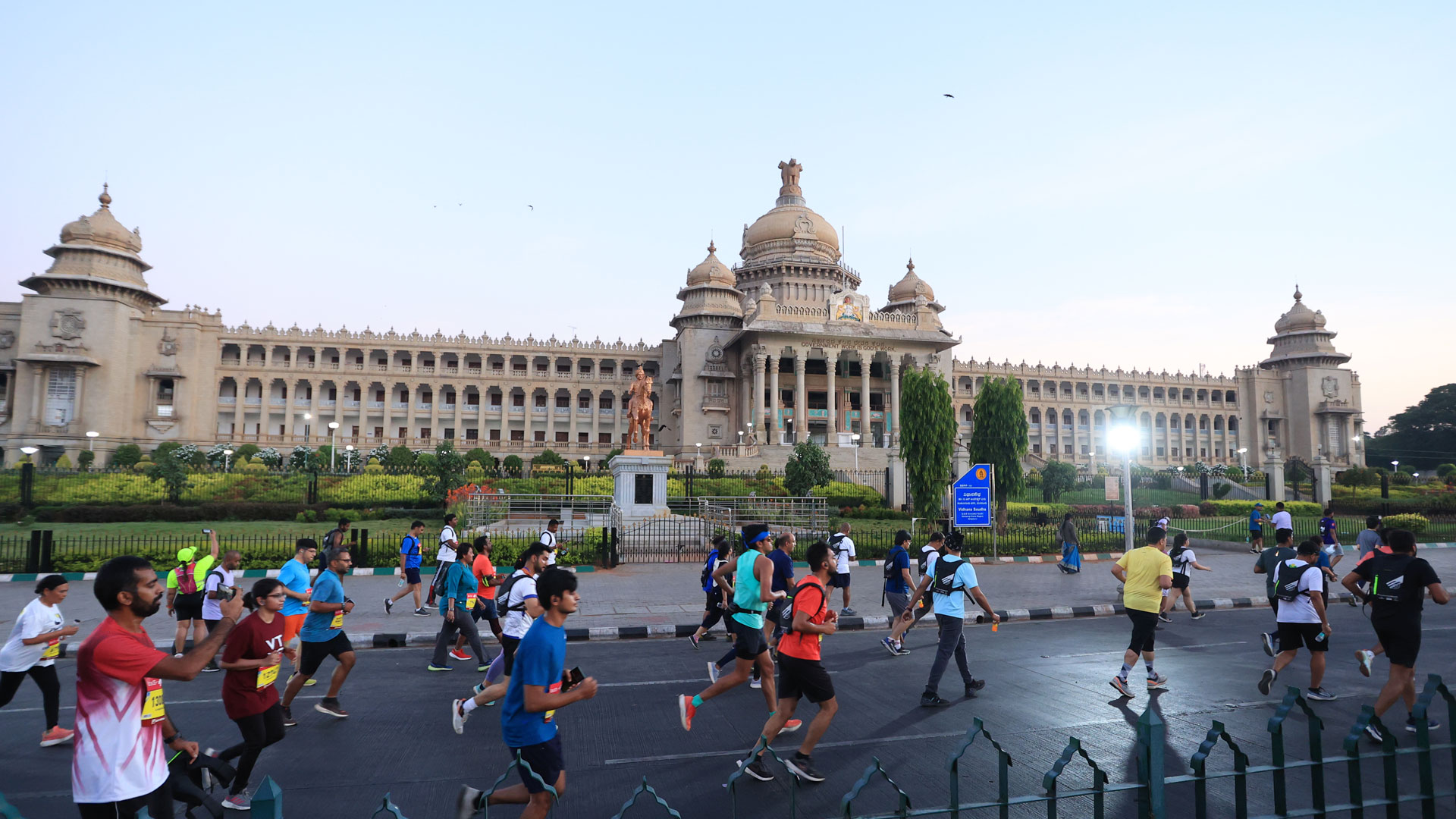 runners passing by the iconcic Vidhana Soudha in Bangalore