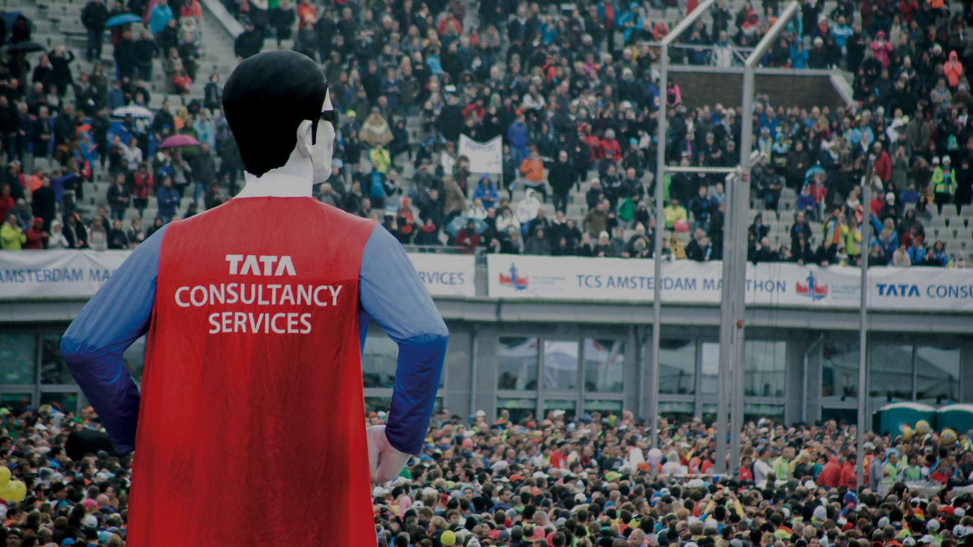 A superman cosplay looms over the TCS Amsterdam Marathon finale crowd